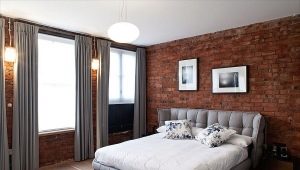 Brick wall in the interior of the bedroom
