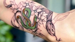 Pārskats par vīriešu tetovējumu ar čūskām uz rokas