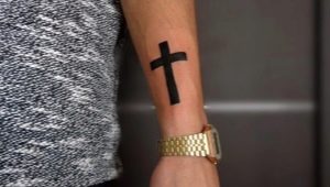 All about men's cross tattoos