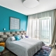 Turquoise wallpaper in the interior of the bedroom
