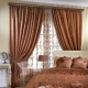 Brown curtains in the interior of the bedroom